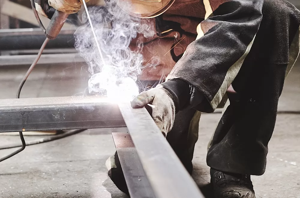 Male,In,Face,Mask,Welds,With,Welding