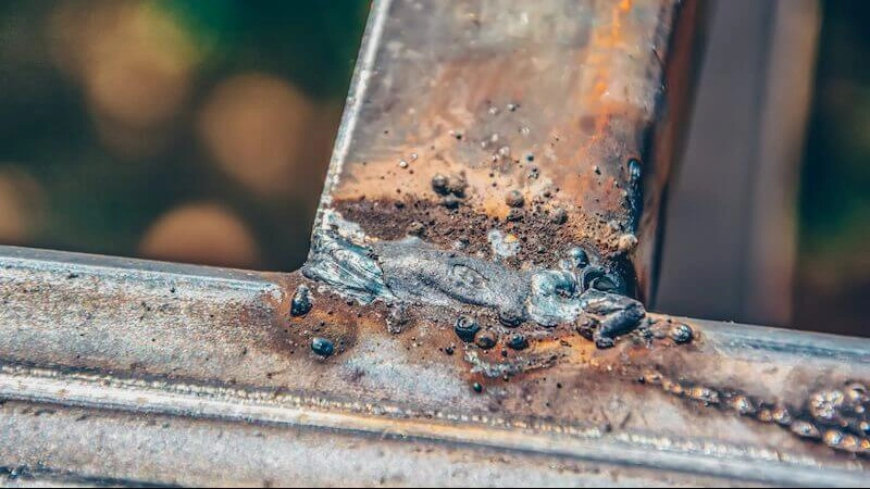 Weld spatter created during MIG welding operation