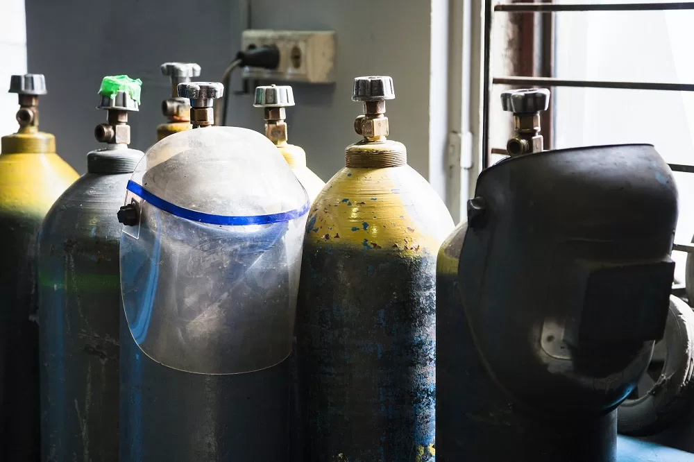 gas cylinders and protection mask in workshop